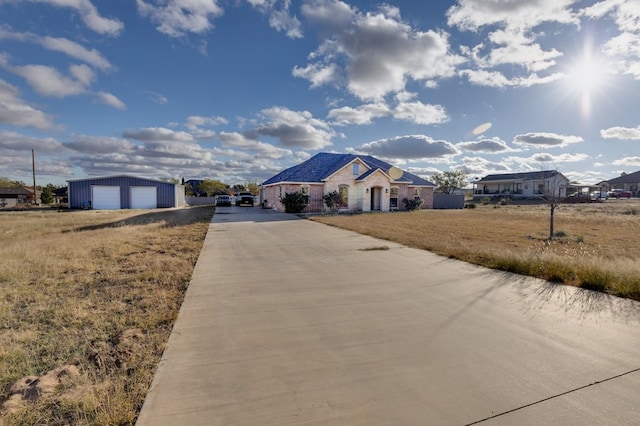 view of road with concrete driveway