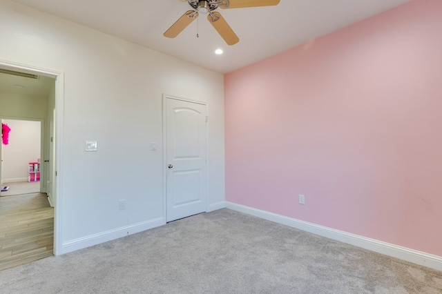 spare room with light carpet, visible vents, baseboards, a ceiling fan, and recessed lighting