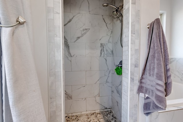 full bathroom with a tile shower