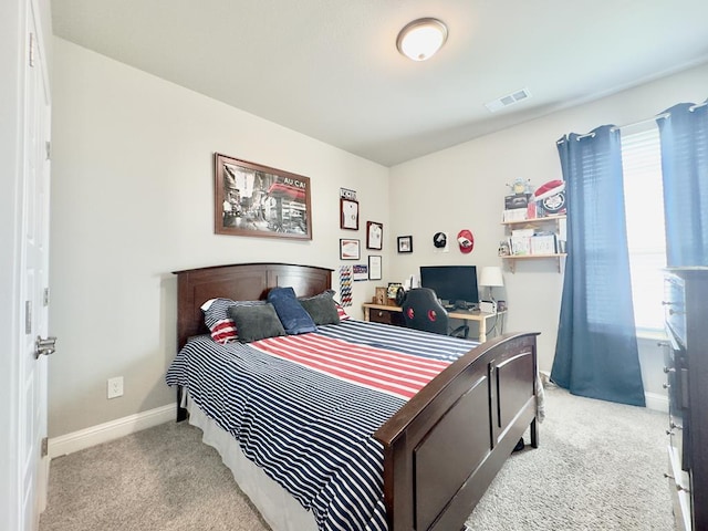 bedroom featuring light carpet, baseboards, and visible vents