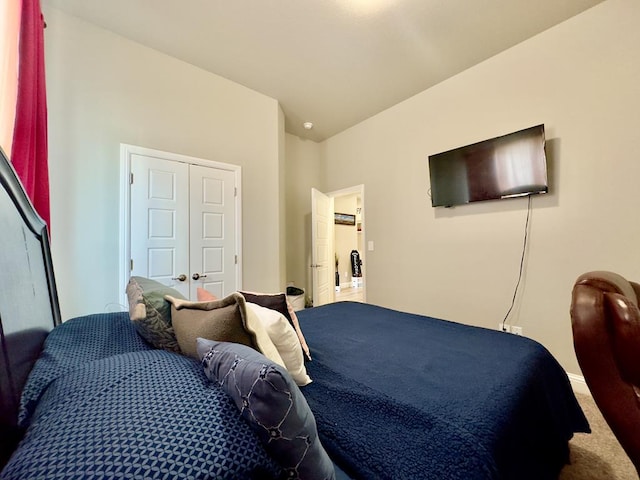 bedroom featuring carpet and baseboards