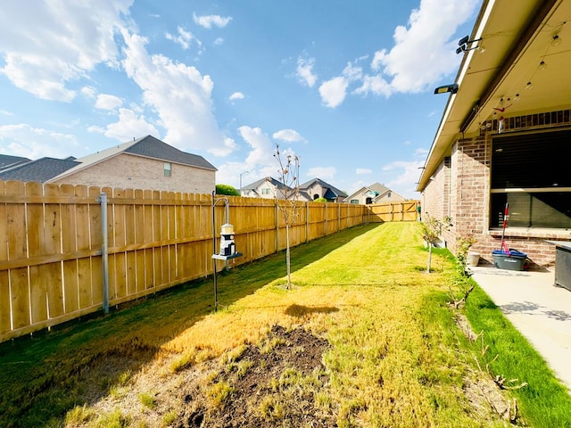 view of yard with a fenced backyard