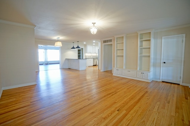 unfurnished living room featuring light hardwood / wood-style floors and ornamental molding