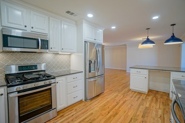 kitchen featuring light hardwood / wood-style flooring, stainless steel appliances, white cabinets, pendant lighting, and backsplash