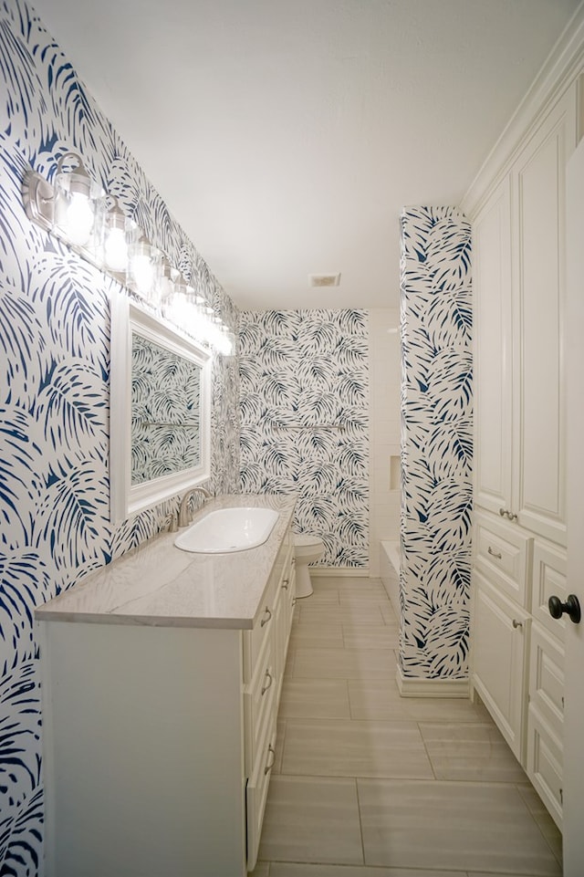 bathroom featuring toilet and vanity