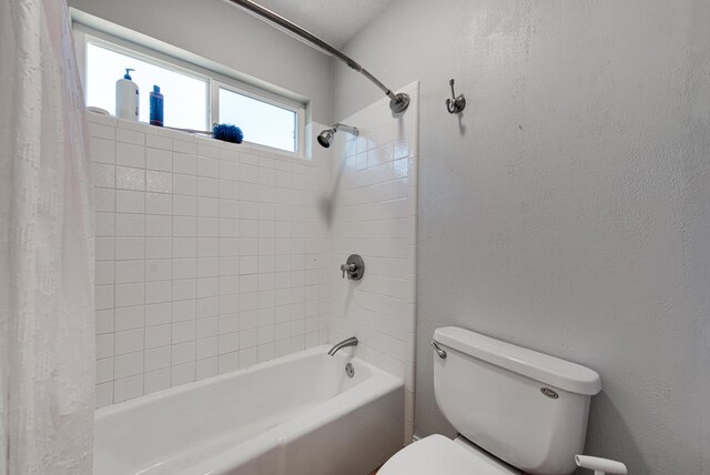 2603 Hughes St, Midland, TX 79705 - bathroom featuring shower / bathtub combination with curtain and a textured wall