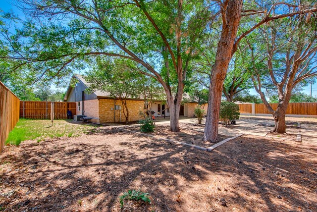 2603 Hughes St, Midland, TX 79705 - fenced backyard with a patio
