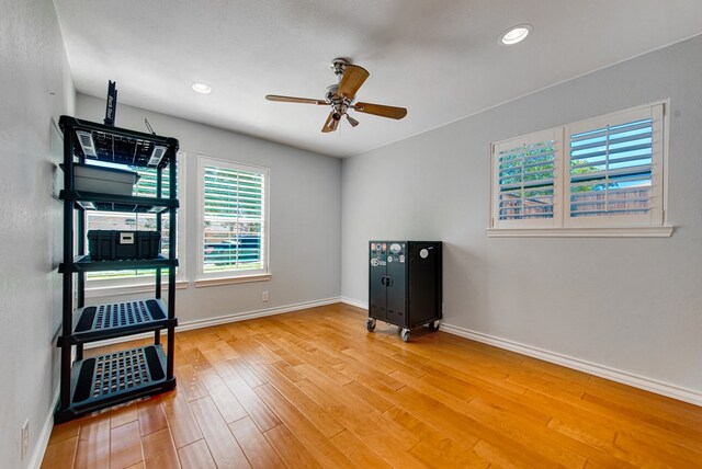 2603 Hughes St, Midland, TX 79705 - workout area with a ceiling fan, light wood-style floors, and recessed lighting