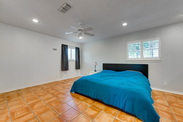 2603 Hughes St, Midland, TX 79705 - tiled bedroom featuring a textured ceiling, recessed lighting, and ceiling fan