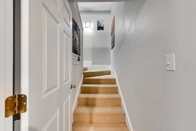 2603 Hughes St, Midland, TX 79705 - staircase featuring a textured wall and carpet