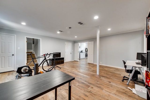 2603 Hughes St, Midland, TX 79705 - home office featuring crown molding, recessed lighting, light wood-style flooring, and decorative columns