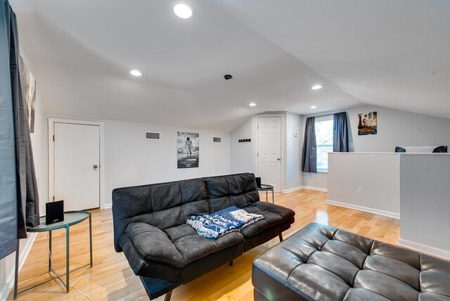 2603 Hughes St, Midland, TX 79705 - living room with light wood-style flooring, vaulted ceiling, and recessed lighting