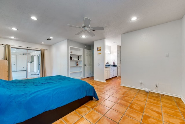 2603 Hughes St, Midland, TX 79705 - bedroom featuring recessed lighting, light tile patterned flooring, a textured ceiling, ceiling fan, and connected bathroom