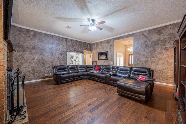 living area featuring wood finished floors, a ceiling fan, ornamental molding, a textured ceiling, and baseboards