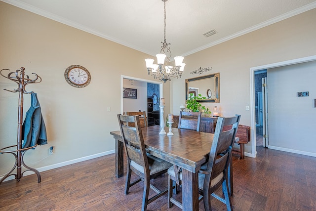 dining area with wood finished floors, crown molding, a chandelier, and baseboards