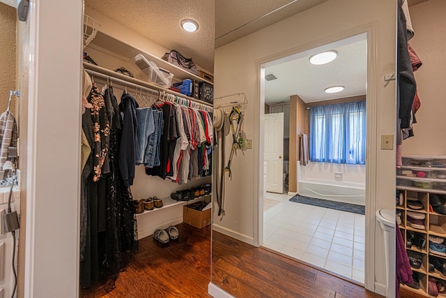 spacious closet featuring wood finished floors