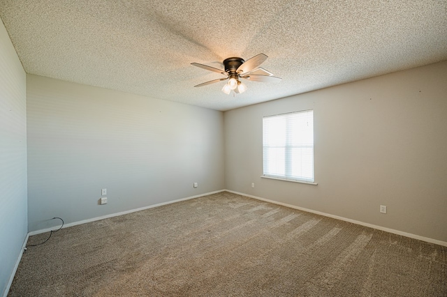 unfurnished room featuring ceiling fan, carpet floors, and a textured ceiling