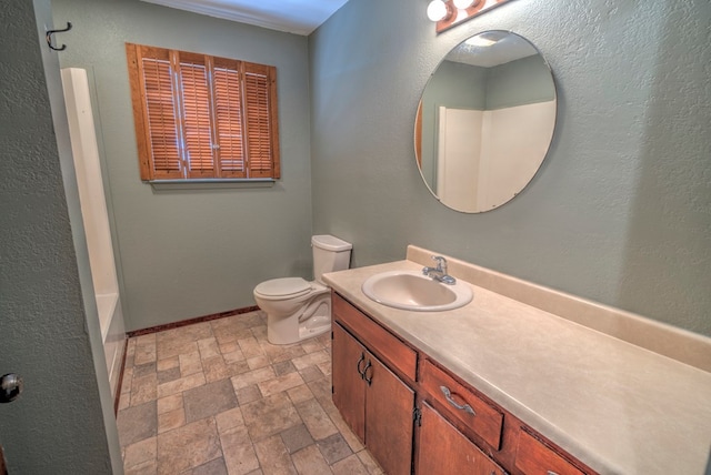 4606 N County Rd 1135, Midland, TX 79705 - bathroom with vanity, stone finish floors, toilet, and baseboards