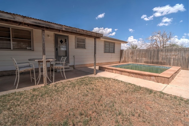 view of pool with a fenced backyard, a fenced in pool, a lawn, and a patio area