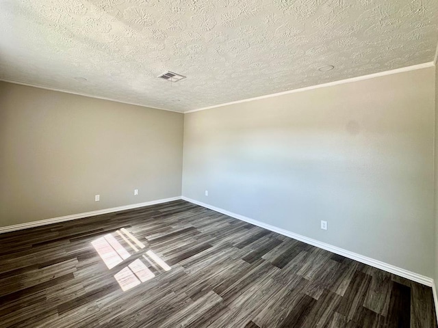 unfurnished room featuring a textured ceiling, crown molding, and dark wood-type flooring