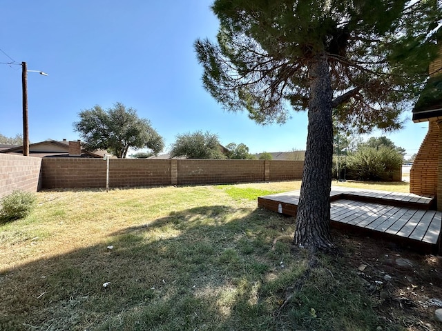 view of yard featuring a wooden deck