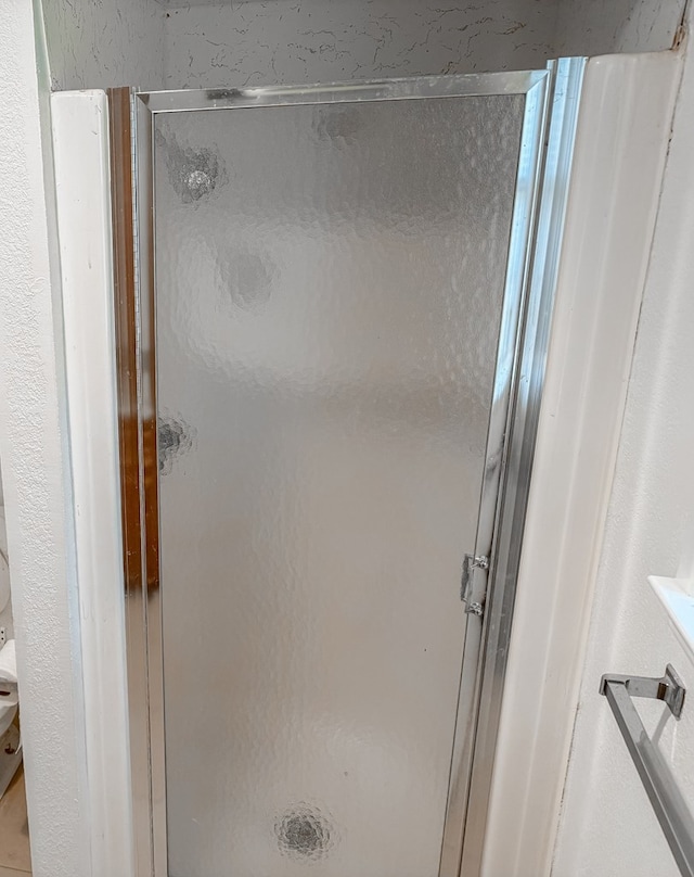 bathroom featuring an enclosed shower