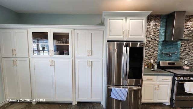 24501 S County Rd 1210, Midland, TX 79706 - kitchen featuring appliances with stainless steel finishes, wall chimney range hood, white cabinets, decorative backsplash, and dark countertops