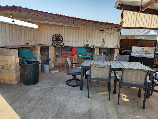 24501 S County Rd 1210, Midland, TX 79706 - view of patio / terrace featuring exterior kitchen and outdoor dining area