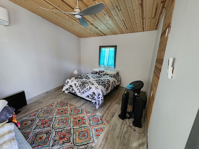 24501 S County Rd 1210, Midland, TX 79706 - bedroom with wooden ceiling, ceiling fan, wood finished floors, vaulted ceiling, and an AC wall unit