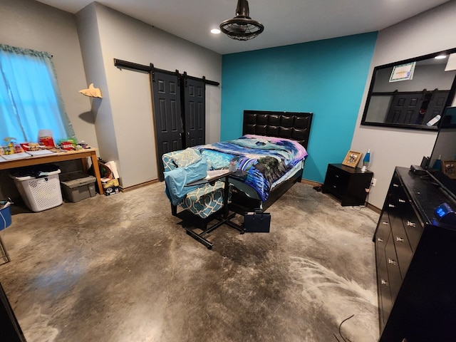 24501 S County Rd 1210, Midland, TX 79706 - bedroom featuring a barn door, unfinished concrete flooring, and recessed lighting