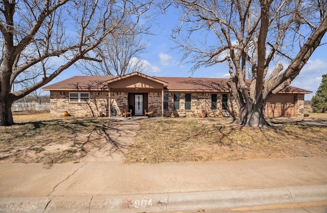 ranch-style house featuring brick siding and an attached garage