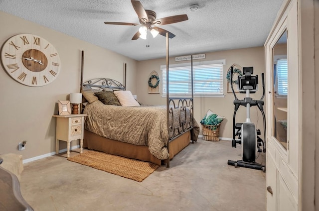 bedroom featuring ceiling fan, a textured ceiling, and baseboards