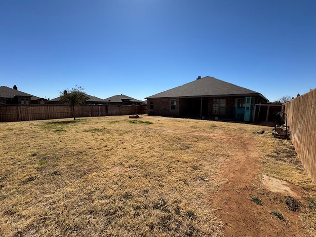 view of yard featuring a fenced backyard