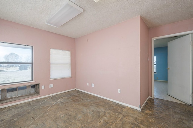 empty room featuring a textured ceiling