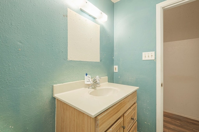 bathroom featuring vanity and wood-type flooring