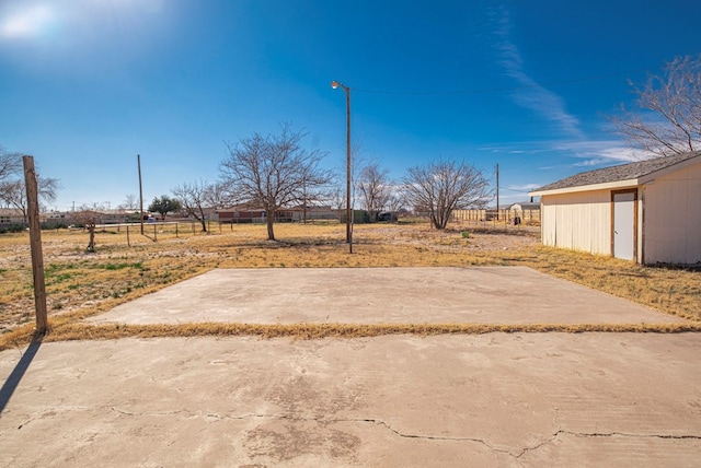 view of yard featuring a patio and a rural view