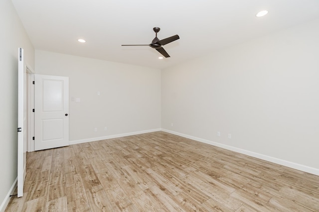 empty room featuring light wood finished floors, recessed lighting, a ceiling fan, and baseboards