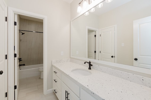 full bath featuring shower / bath combination, toilet, and vanity