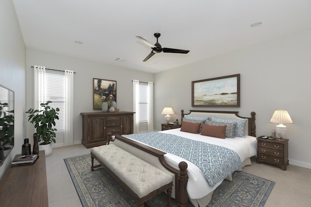 bedroom with light carpet, baseboards, and a ceiling fan