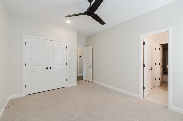 unfurnished bedroom featuring a closet, baseboards, and carpet floors