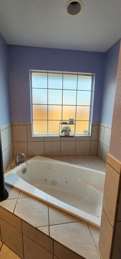 bathroom featuring a whirlpool tub