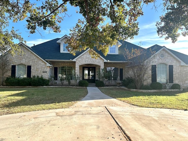 view of front of home featuring french doors and a front lawn