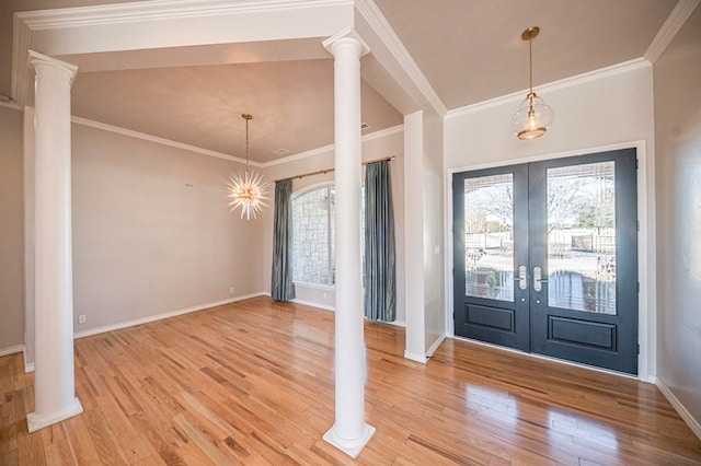 entryway featuring crown molding, french doors, and wood-type flooring