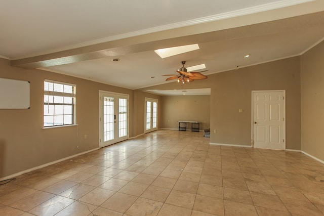 tiled spare room with crown molding and ceiling fan