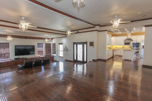 living room with beam ceiling, dark hardwood / wood-style floors, and crown molding