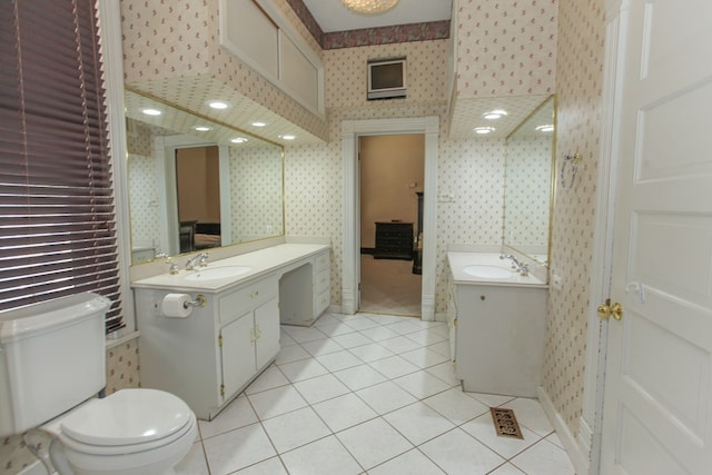 bathroom with tile patterned floors, vanity, and toilet