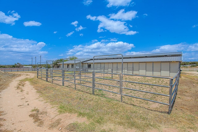 view of stable featuring a rural view