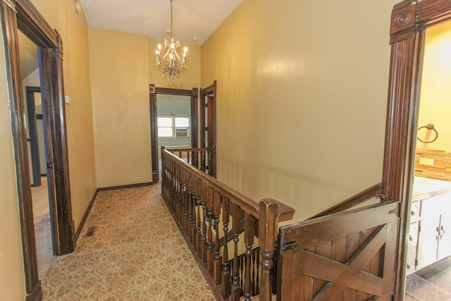 hallway with a notable chandelier