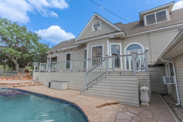 back of property with a patio area and cooling unit