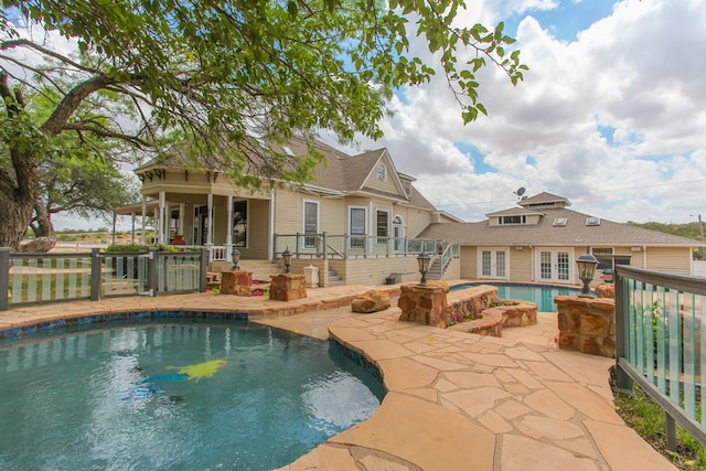 view of swimming pool with a patio